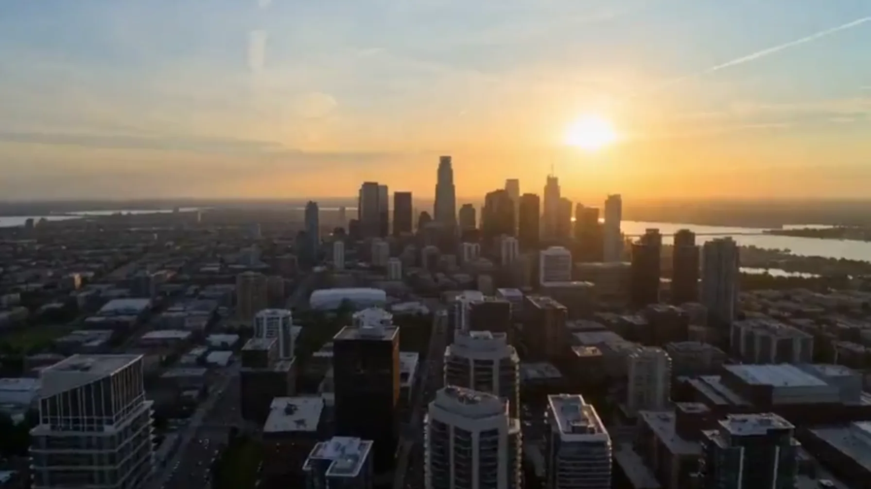 Sora video extender turning an aerial city shot at sunset into the first part of a longer sequence